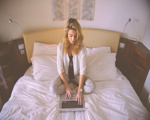 Indonesian professional enjoying a relaxed posture while working from home