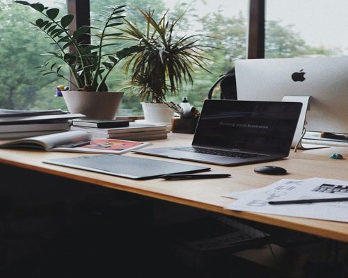 Organized home office desk near a window
