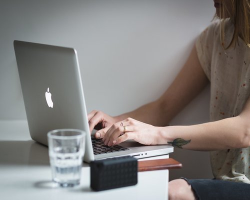 Glass of water on a modern work desk